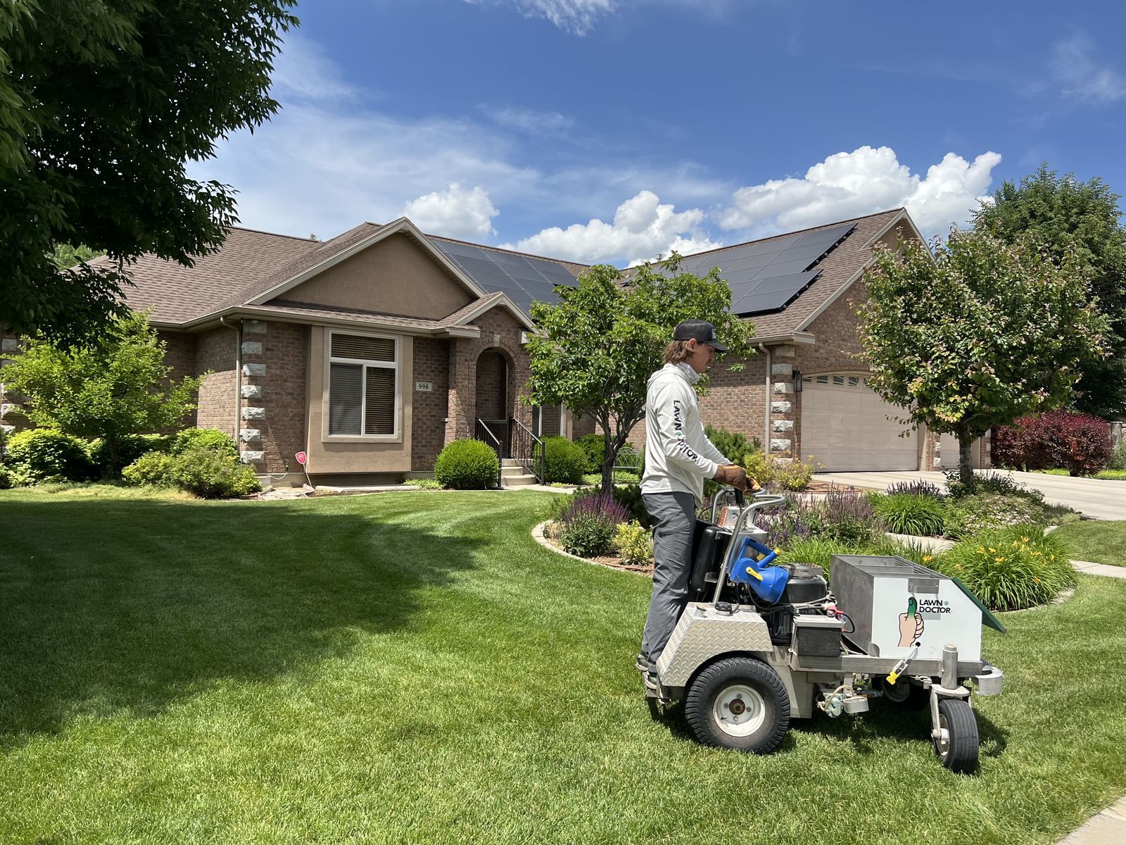 Lawn Doctor technician fertilizing a lawn